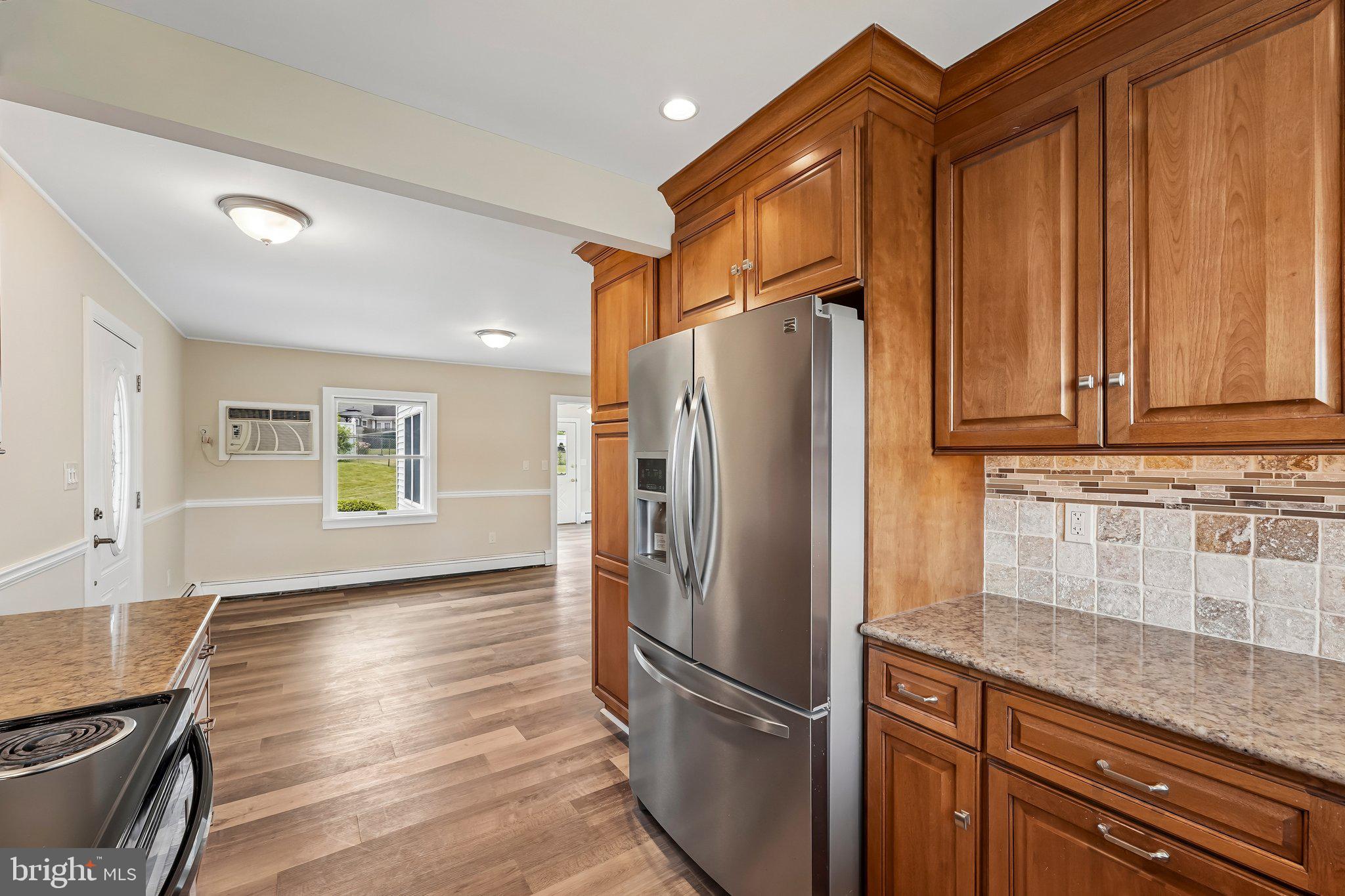 9 Rustleaf Lane Levittown, PA 19055 - Photo 27 of 45 Modern kitchen with warm wood accents.