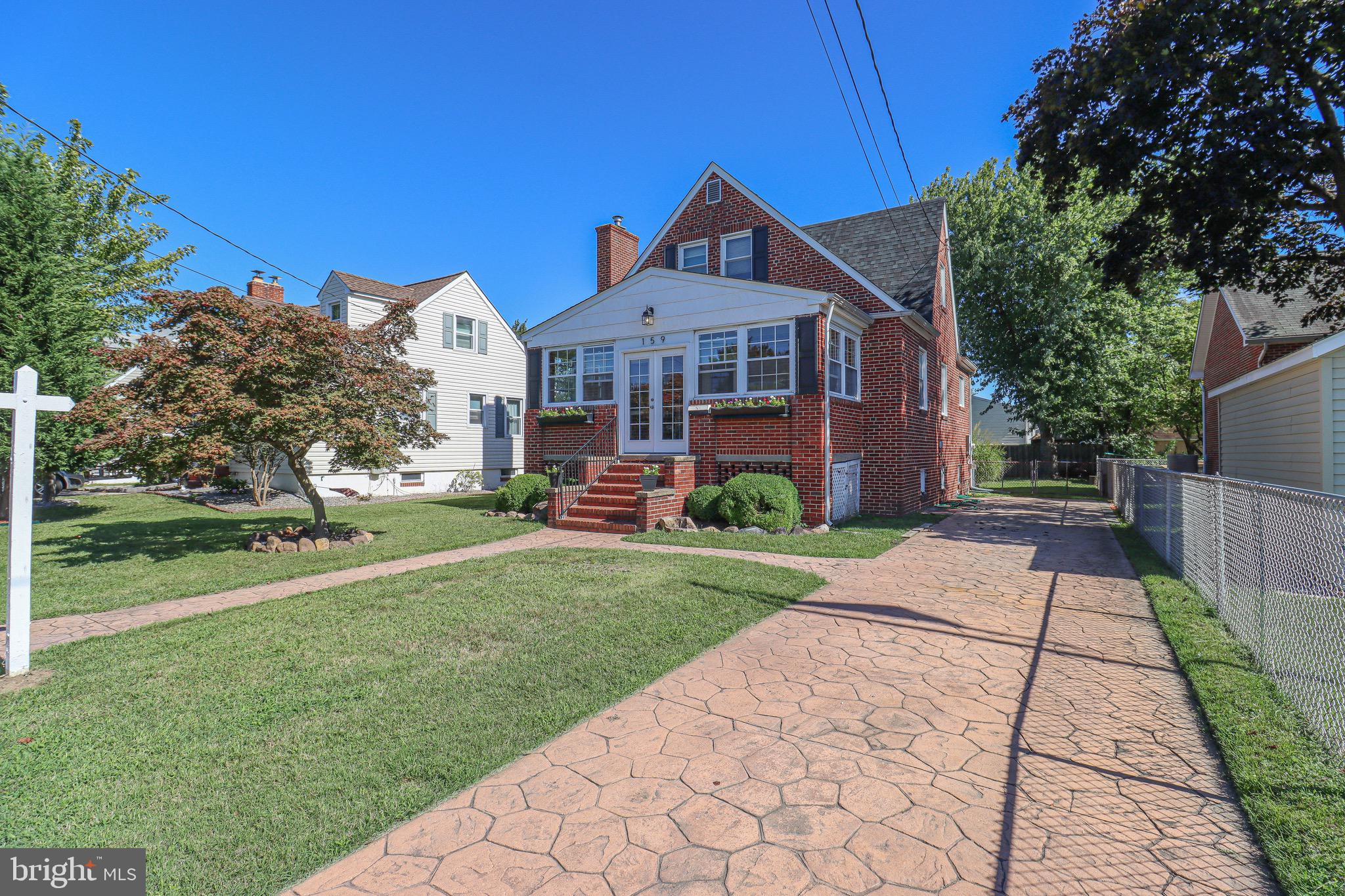 159 Meadow Road Pasadena, MD 21122 - Photo 4 of 56 50' Stamped Concrete Driveway