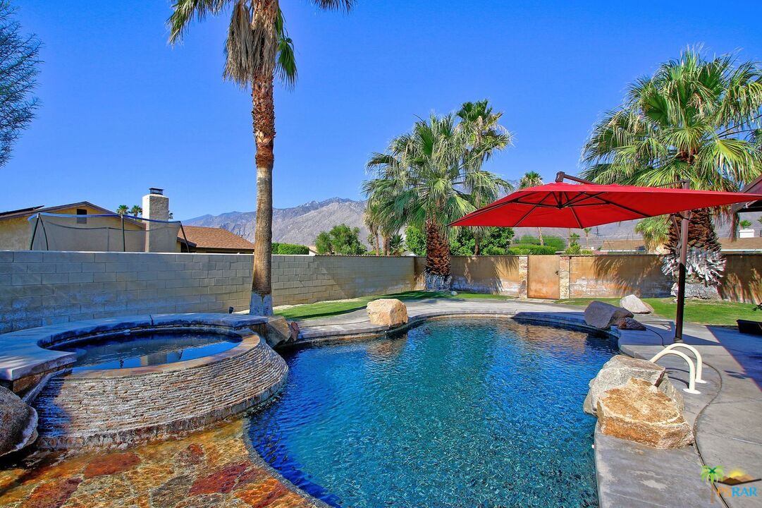 2288 North Deborah Road Palm Springs, CA 92262 - Photo 1 of 33 a view of a swimming pool with a patio