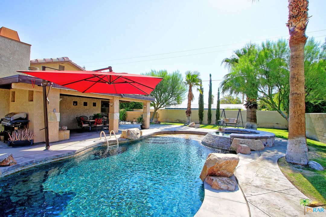 2288 North Deborah Road Palm Springs, CA 92262 - Photo 15 of 33 a view of a house with backyard sitting area and swimming pool