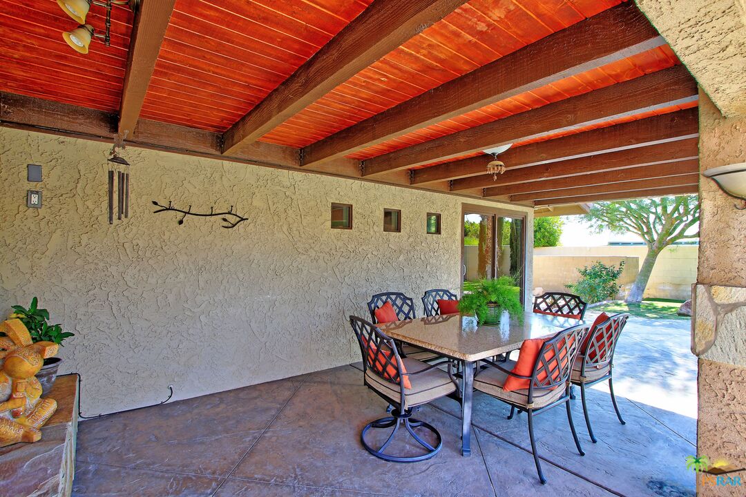 2288 North Deborah Road Palm Springs, CA 92262 - Photo 19 of 33 a view of an outdoor sitting area with furniture and wooden floor