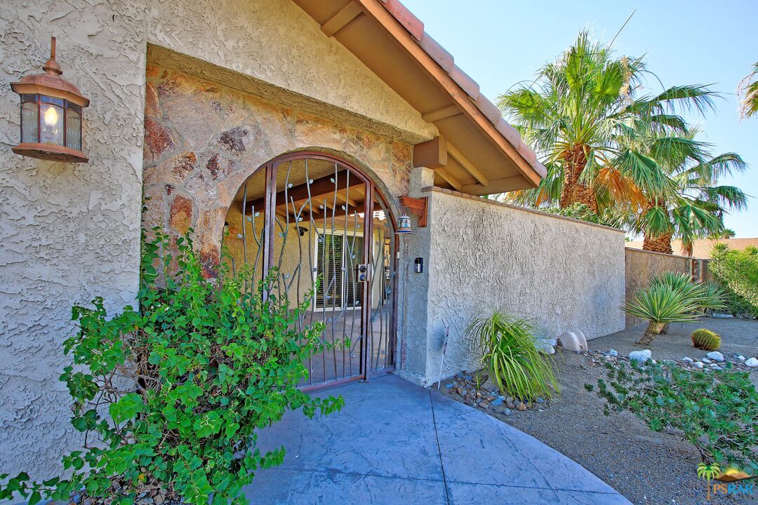 2288 North Deborah Road Palm Springs, CA 92262 - Photo 2 of 33 a front view of a house with garden