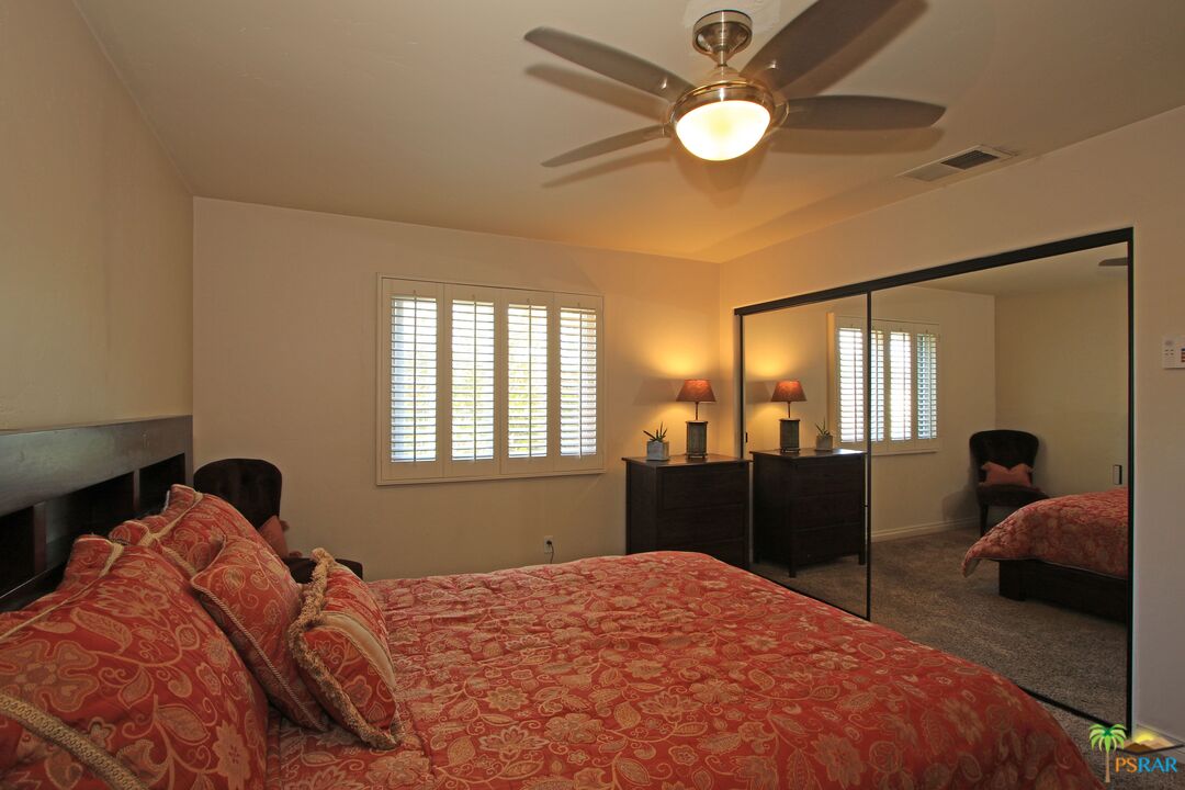 2288 North Deborah Road Palm Springs, CA 92262 - Photo 21 of 33 a bedroom with a bed and window