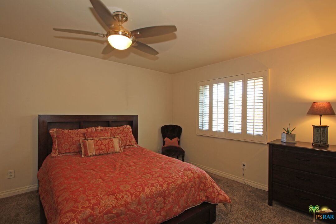 2288 North Deborah Road Palm Springs, CA 92262 - Photo 22 of 33 a bedroom with a bed and a window