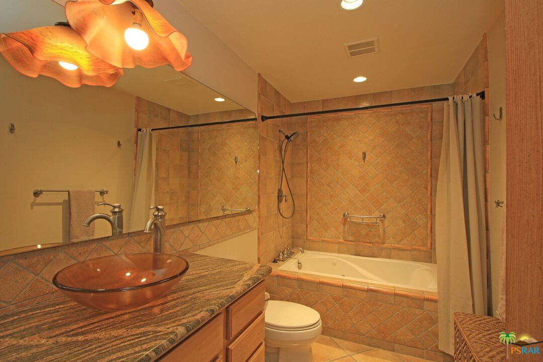 2288 North Deborah Road Palm Springs, CA 92262 - Photo 24 of 33 a bathroom with a sink a toilet and shower