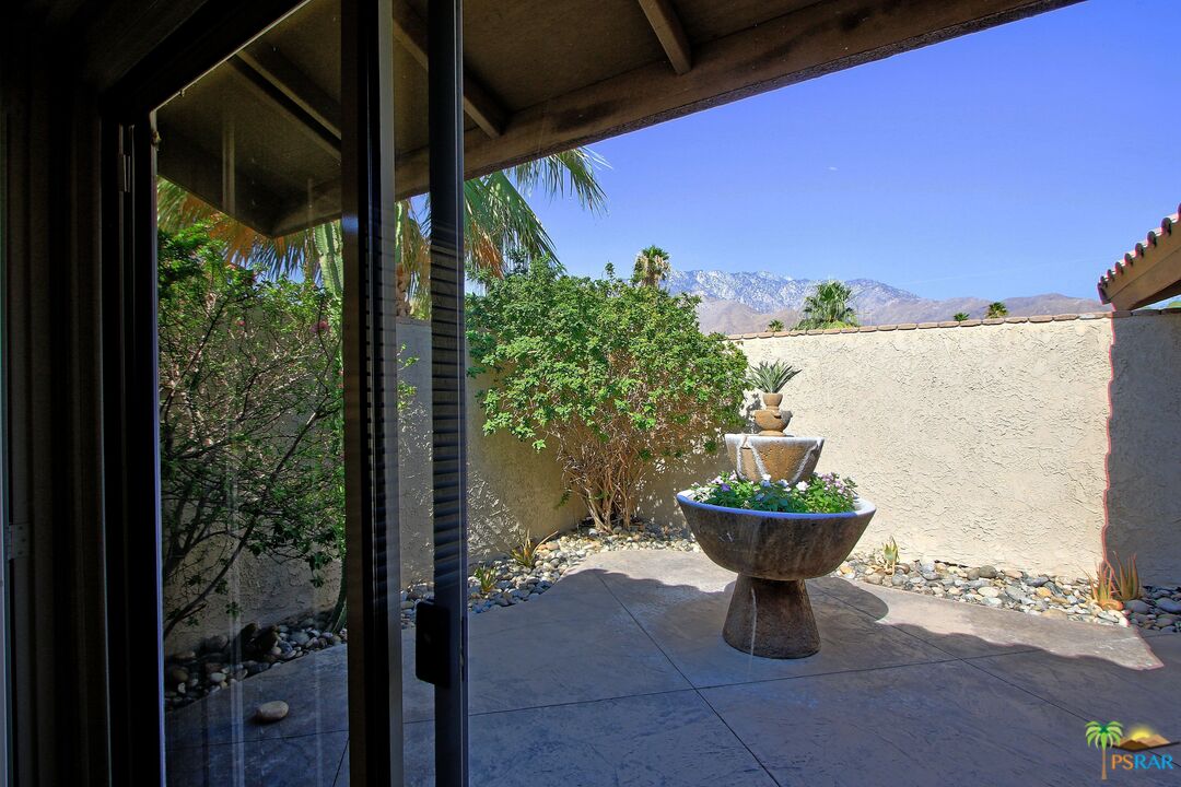 2288 North Deborah Road Palm Springs, CA 92262 - Photo 31 of 33 a view of a porch with chairs and potted plants