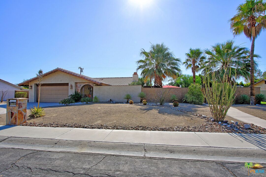 2288 North Deborah Road Palm Springs, CA 92262 - Photo 33 of 33 a front view of a house with a yard and garage
