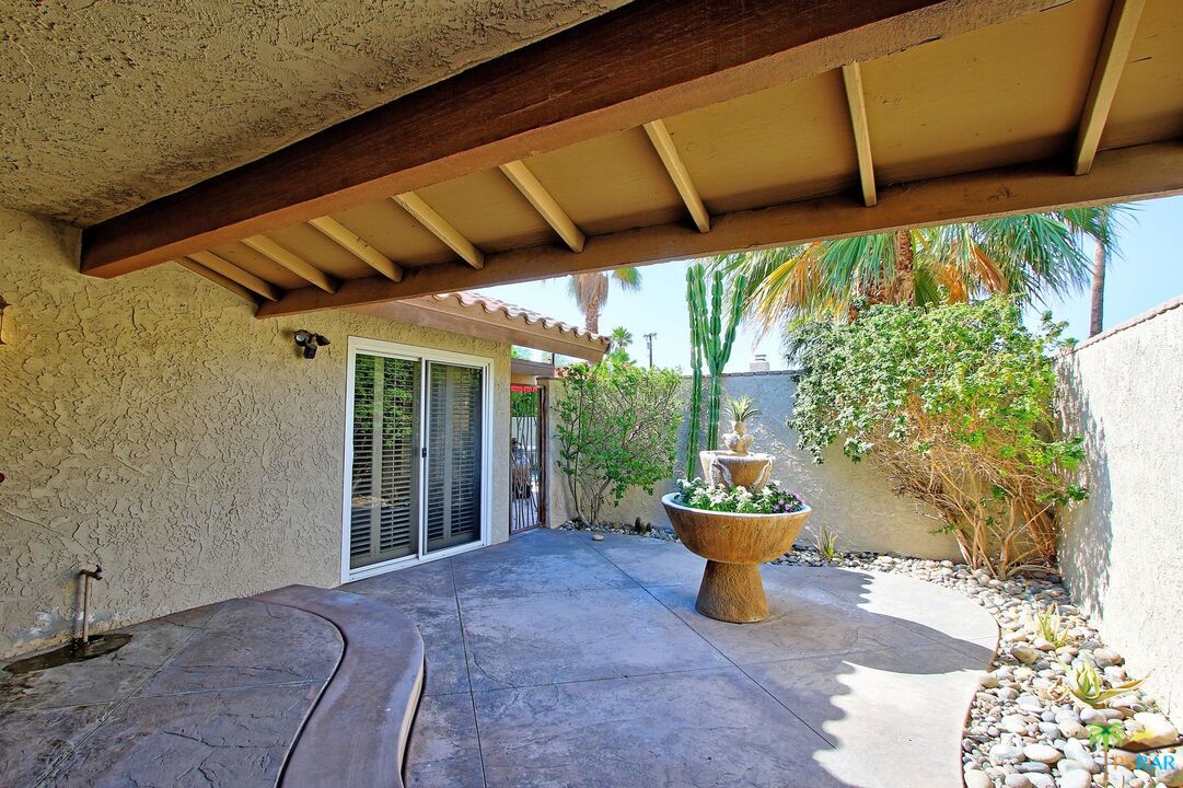 2288 North Deborah Road Palm Springs, CA 92262 - Photo 5 of 33 a backyard of a house with a table and chairs