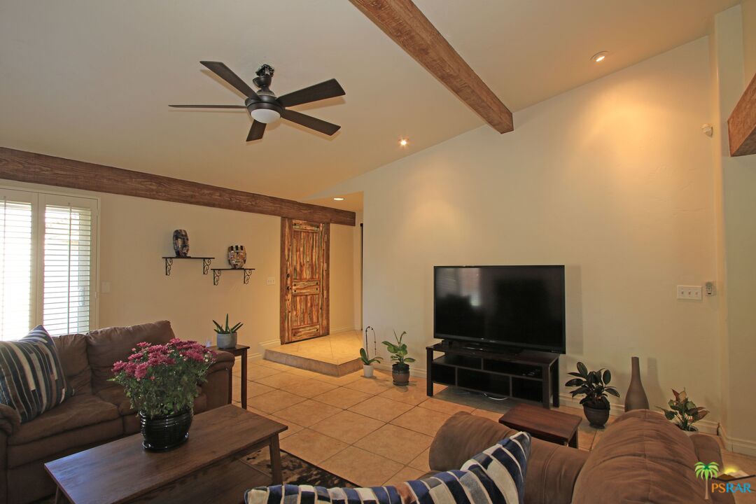 2288 North Deborah Road Palm Springs, CA 92262 - Photo 8 of 33 a living room with furniture and a flat screen tv