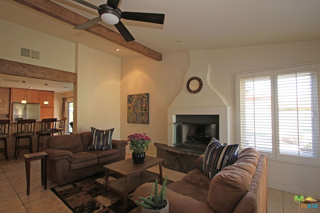 2288 North Deborah Road Palm Springs, CA 92262 - Photo 9 of 33 a living room with furniture a fireplace and window