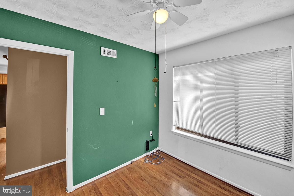 13257 Wonderland Way, Unit 1101 Germantown, MD 20874 - Photo 14 of 51 a view of a room with a ceiling fan and a window