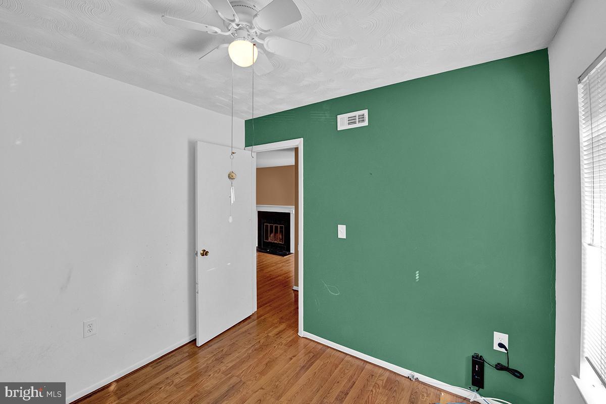 13257 Wonderland Way, Unit 1101 Germantown, MD 20874 - Photo 15 of 51 an empty room with wooden floor and closet