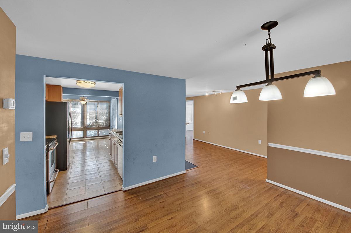 13257 Wonderland Way, Unit 1101 Germantown, MD 20874 - Photo 18 of 51 a view of empty room with wooden floor