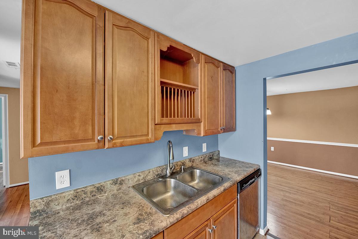 13257 Wonderland Way, Unit 1101 Germantown, MD 20874 - Photo 24 of 51 a kitchen with a sink and cabinets