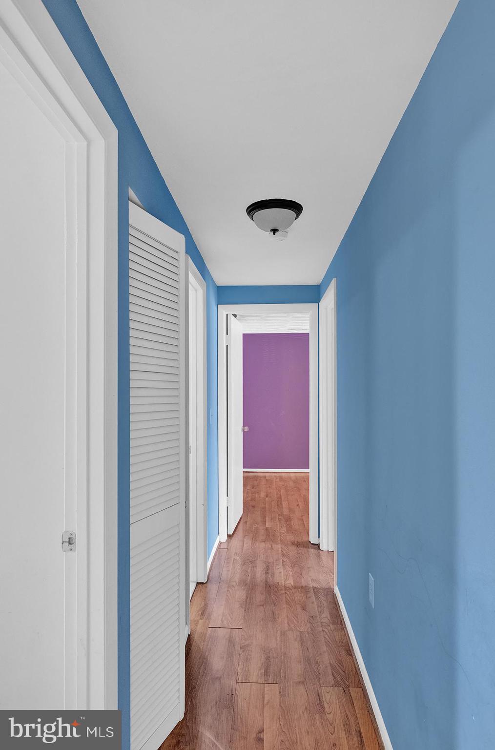 13257 Wonderland Way, Unit 1101 Germantown, MD 20874 - Photo 31 of 51 a view of hallway with wooden floor