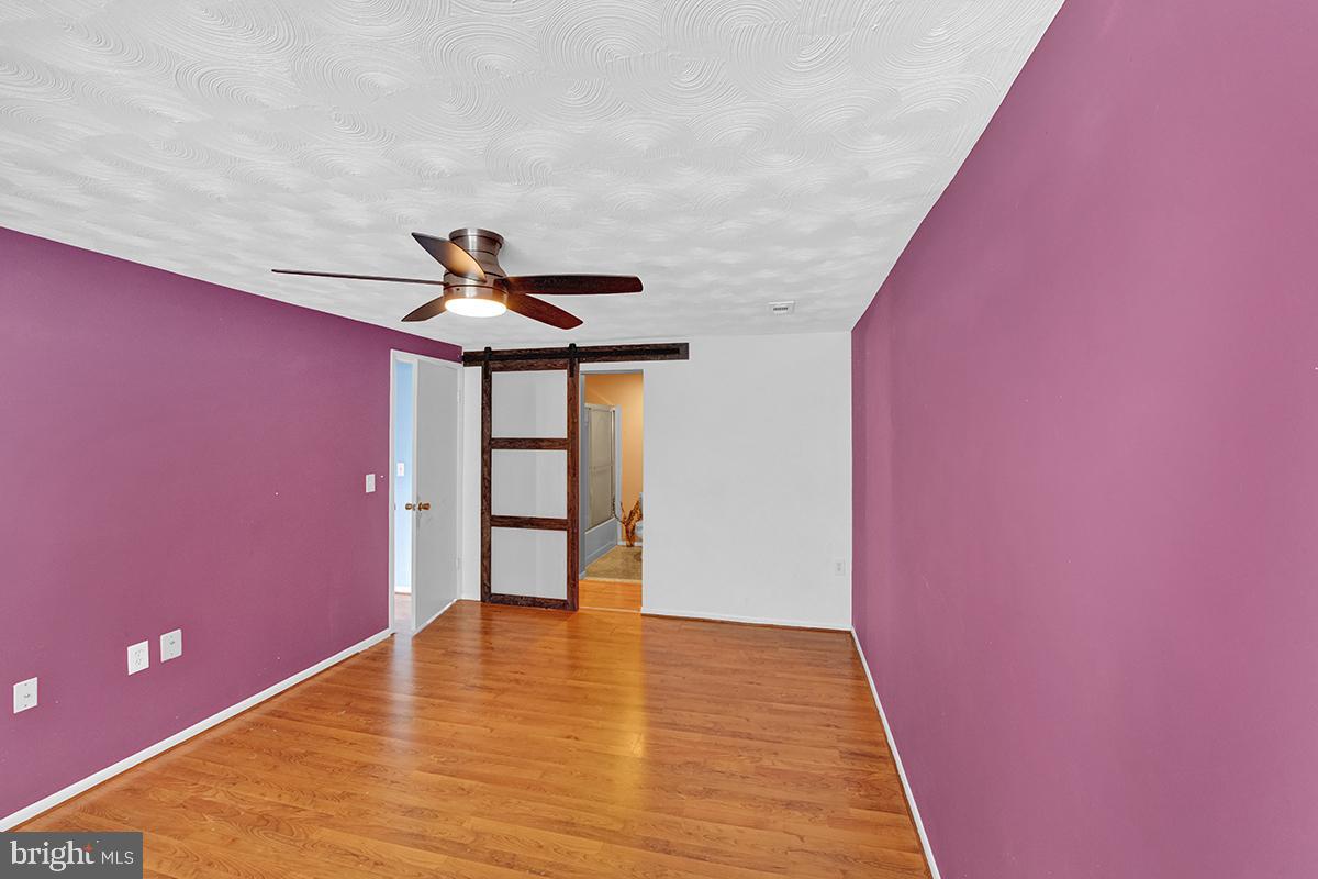 13257 Wonderland Way, Unit 1101 Germantown, MD 20874 - Photo 39 of 51 a view of empty room with wooden floor