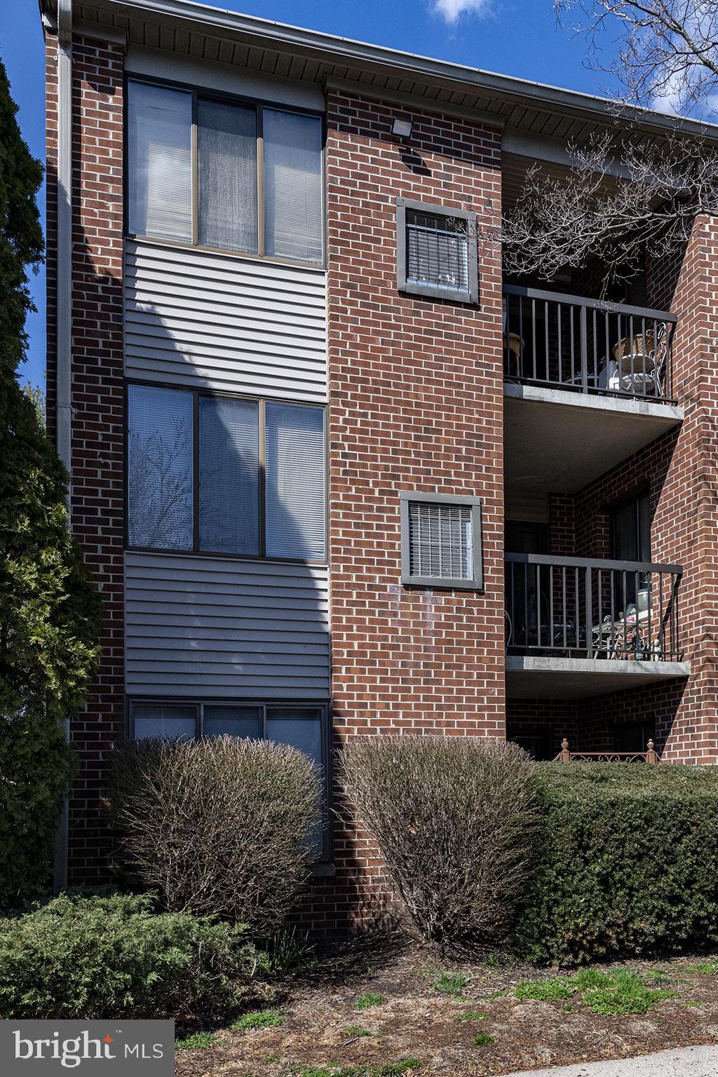 13257 Wonderland Way, Unit 1101 Germantown, MD 20874 - Photo 50 of 51 front view of a house with a balcony