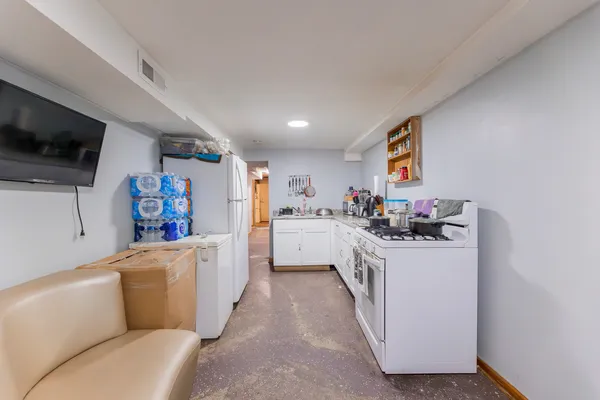 a utility room with sink dryer and washer
