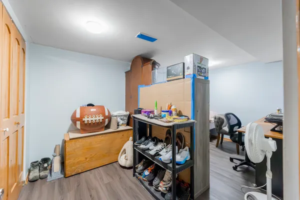 a room with furniture and wooden floor