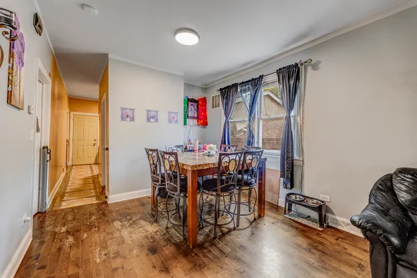 a view of a dining room with furniture and a rug