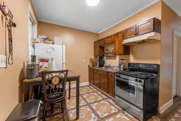a kitchen with a stove and a microwave