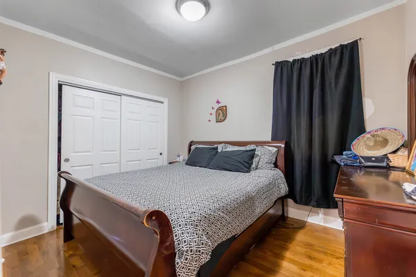 a bed room with a bed and a window