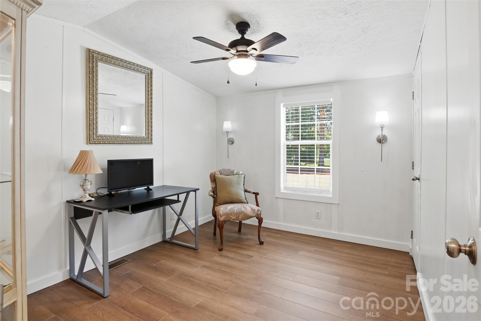 4406 Lucy Short Cut Road Marshville, NC 28103 - Photo 20 of 30 a work room with furniture and windows