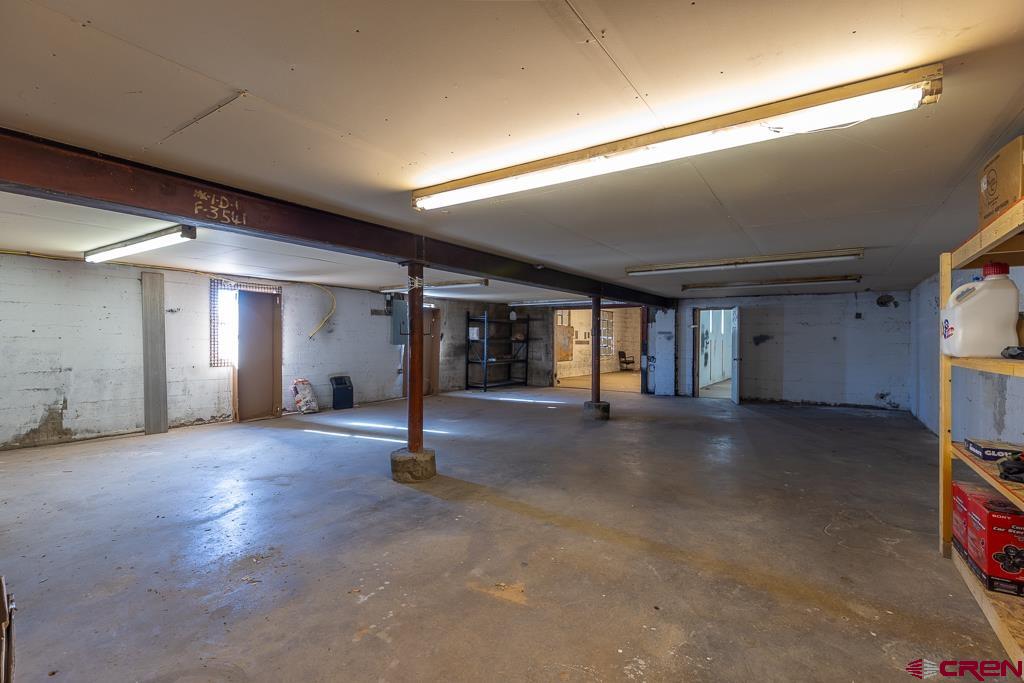 27 South Broadway Cortez, CO 81321 - Photo 16 of 35 a view of empty room with windows