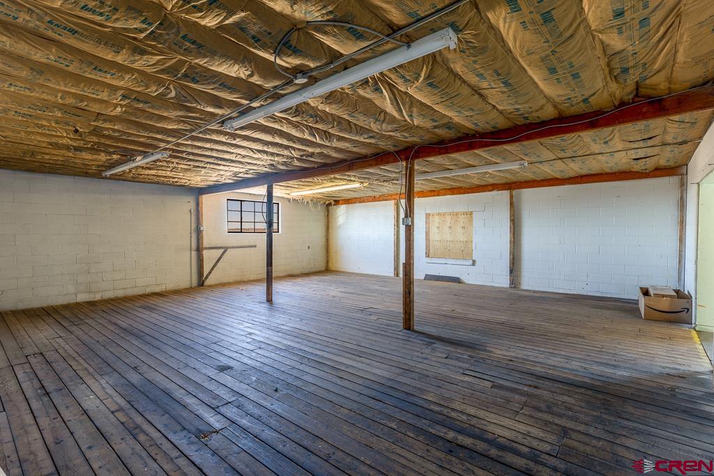27 South Broadway Cortez, CO 81321 - Photo 26 of 35 a view of empty room with wooden floor