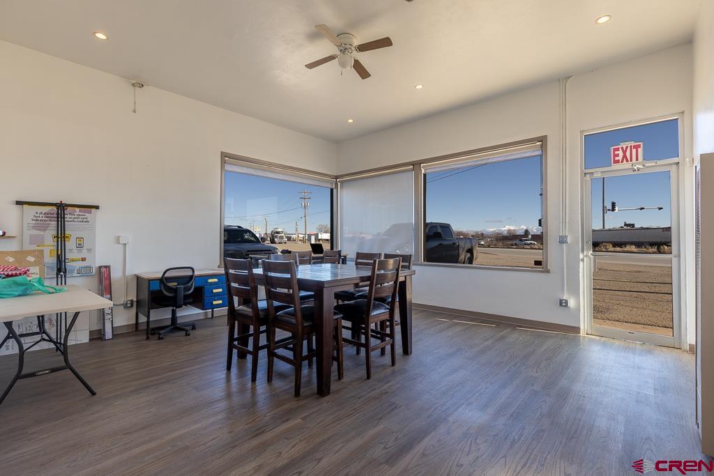 27 South Broadway Cortez, CO 81321 - Photo 6 of 35 a view of a dining room with furniture and wooden floor