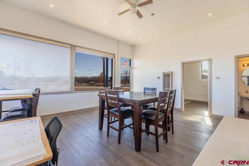 27 South Broadway Cortez, CO 81321 - Photo 7 of 35 a view of a a dining room with furniture window and wooden floor