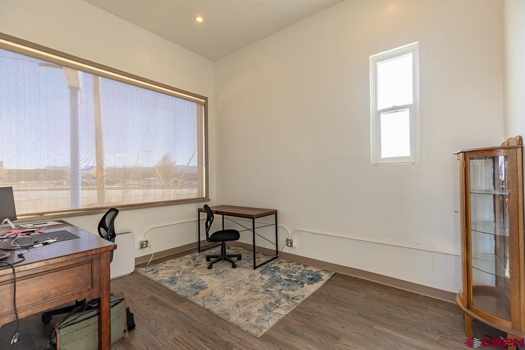 27 South Broadway Cortez, CO 81321 - Photo 8 of 35 a view of a workspace with furniture and a window