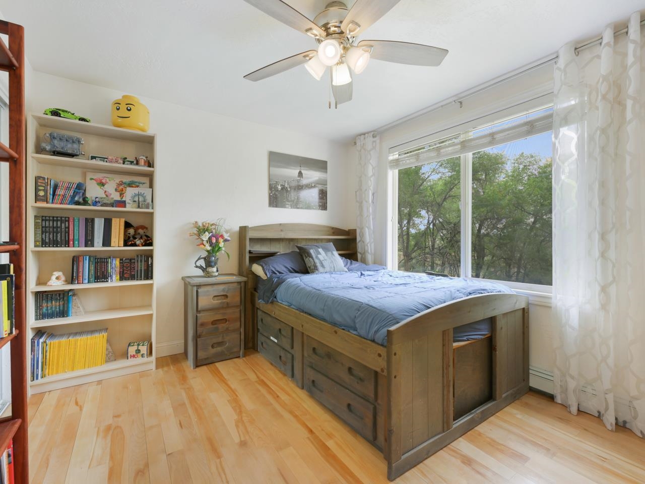 2433 H Road Grand Junction, CO 81505 - Photo 29 of 42 a bedroom with a bed and a cabinets