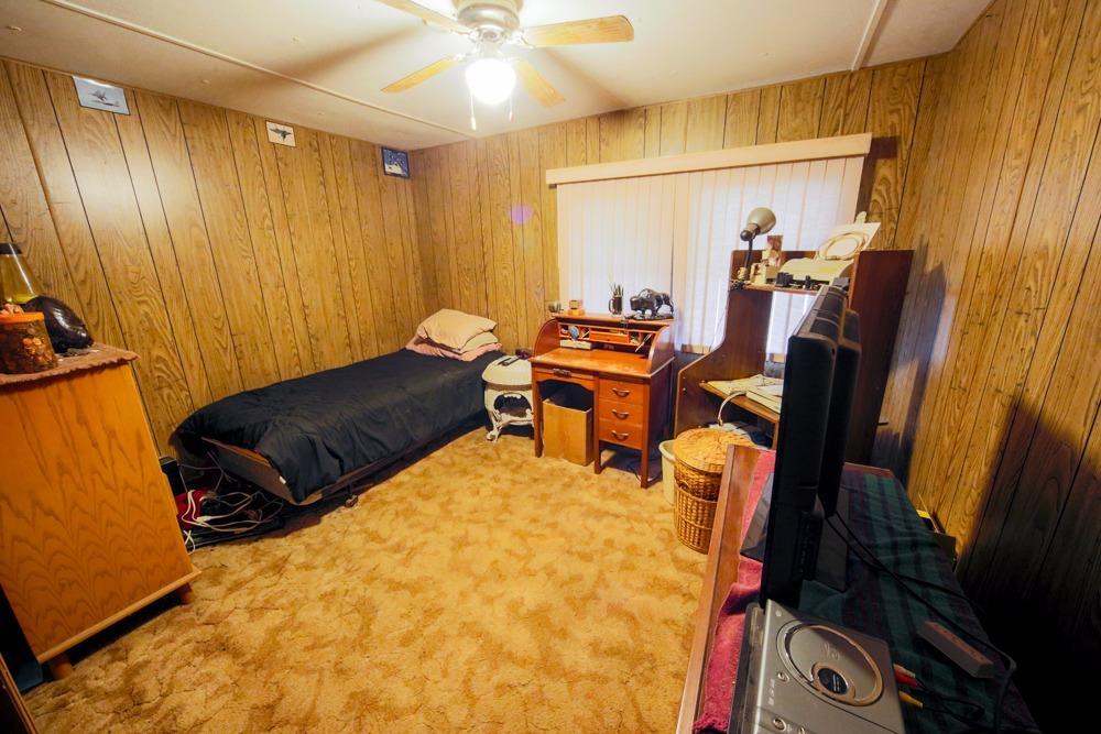 15655 Jones Road White City, OR 97503 - Photo 22 of 28 a living room with furniture and a flat screen tv