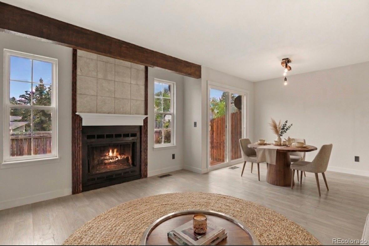 8771 Carr Loop Arvada, CO 80005 - Photo 4 of 16 a view of a livingroom with furniture and a fireplace