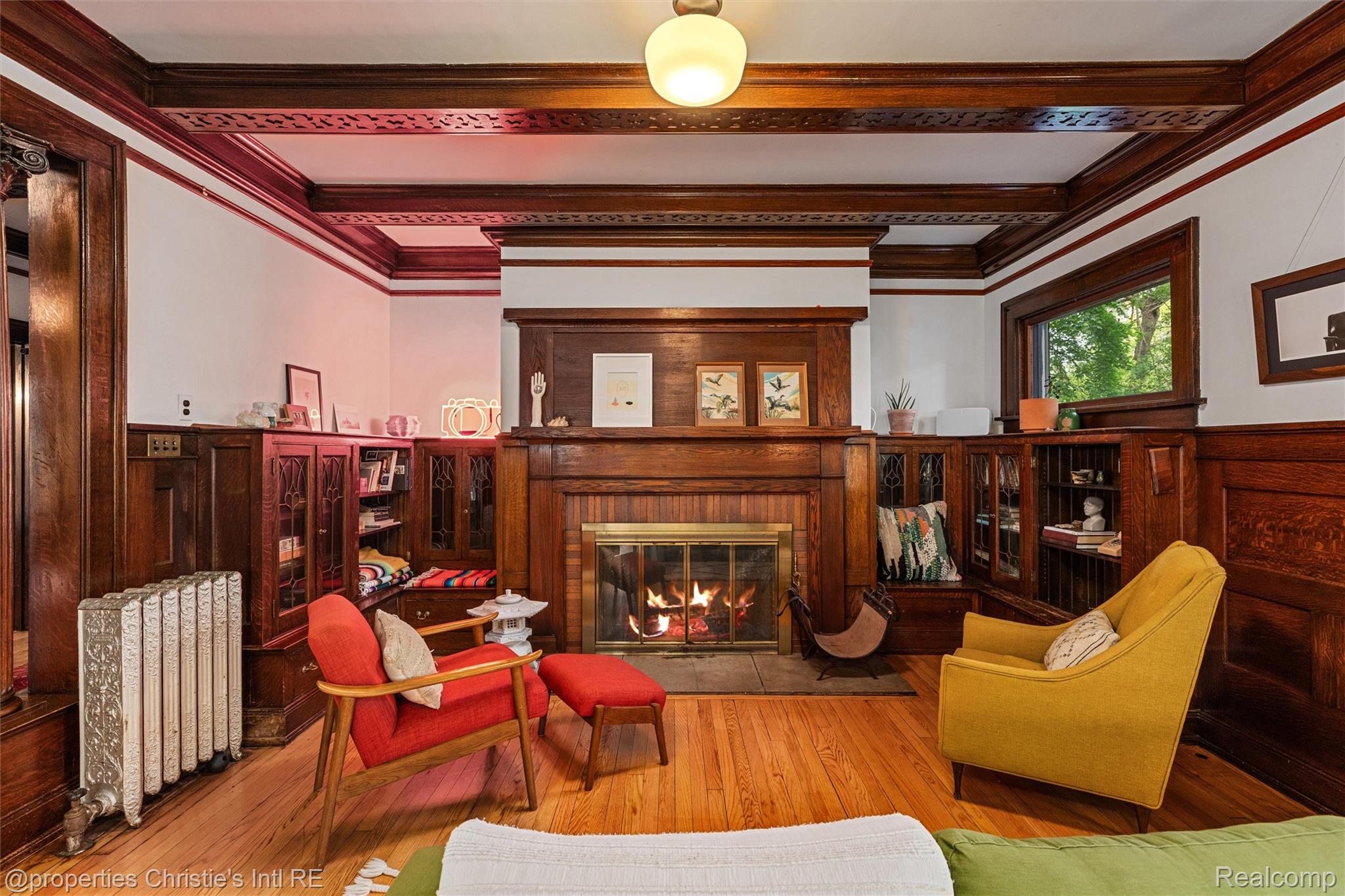36 Longfellow Street Detroit, MI 48202 - Photo 27 of 81 Sitting room featuring a wainscoted wall, crown molding, light wood-style floors, a fireplace, and beamed ceiling
