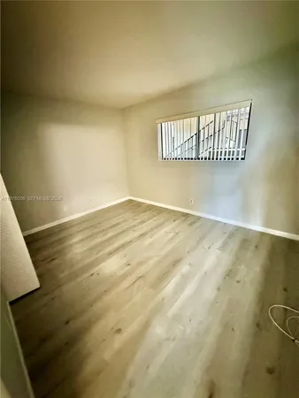 a room with walk in closet and a window