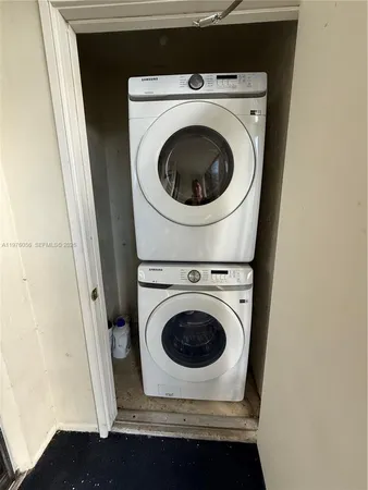 a view of a kitchen with an empty space and a fireplace