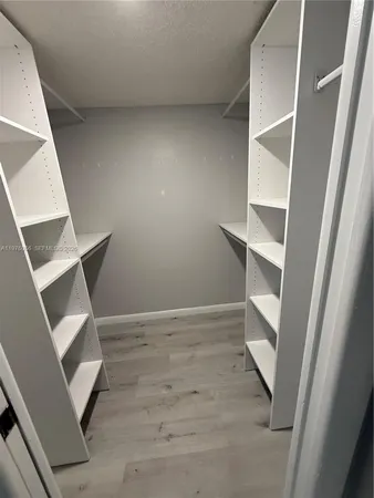 a bathroom with a sink mirror vanity and toilet