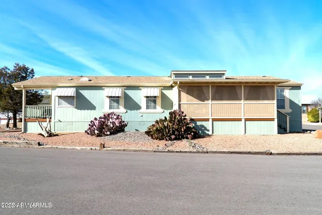 a front view of a house with a garage