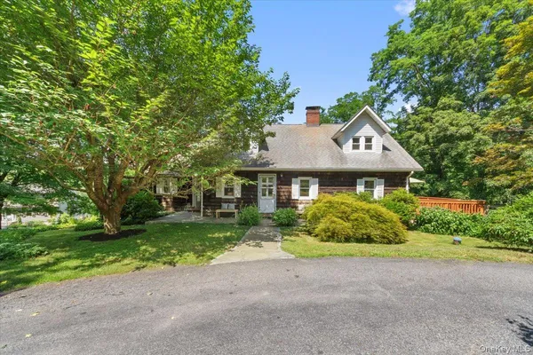 a aerial view of a house with a yard