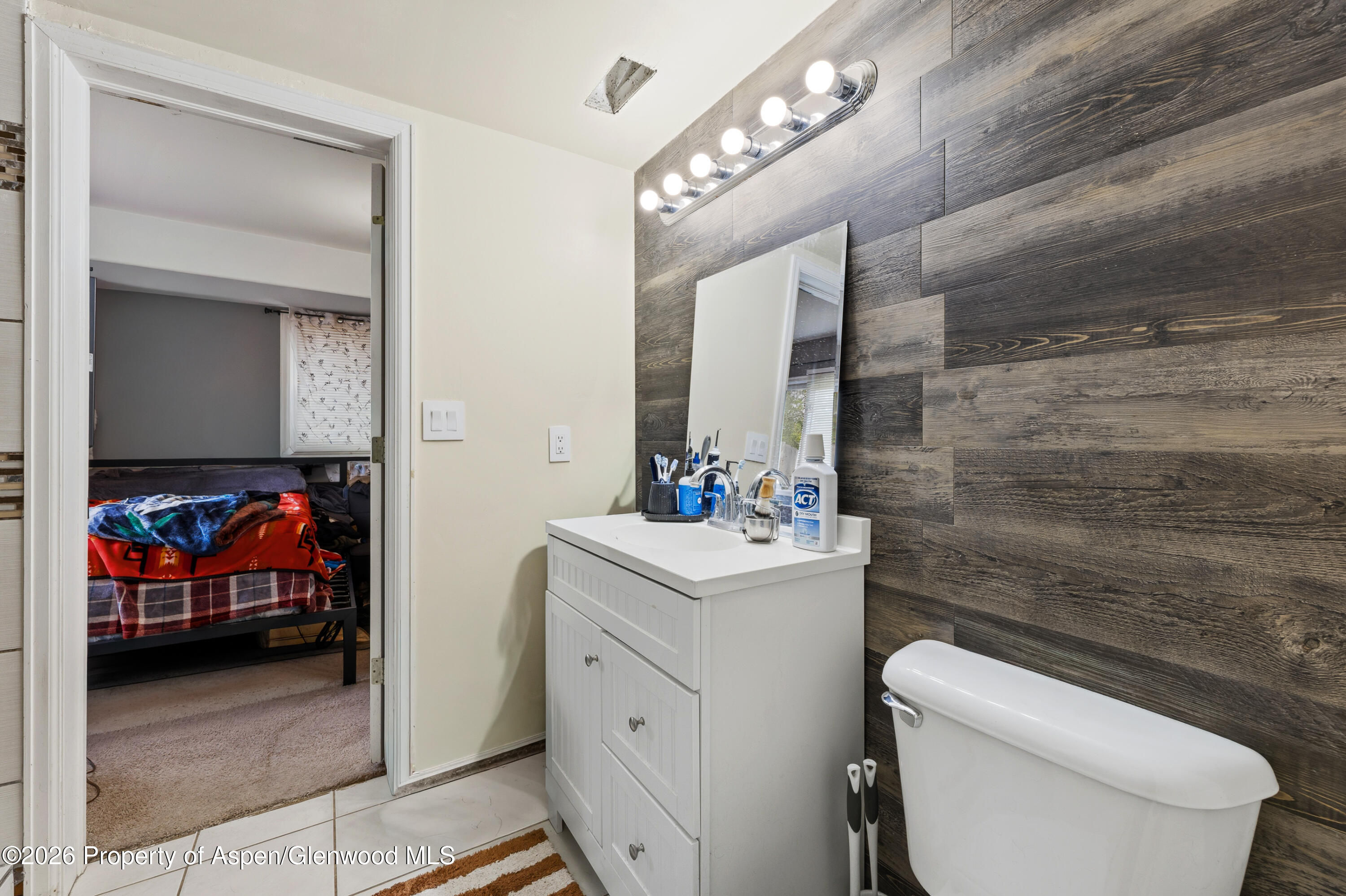 164 Current Drive New Castle, CO 81647 - Photo 19 of 34 a bathroom with a toilet sink and mirror