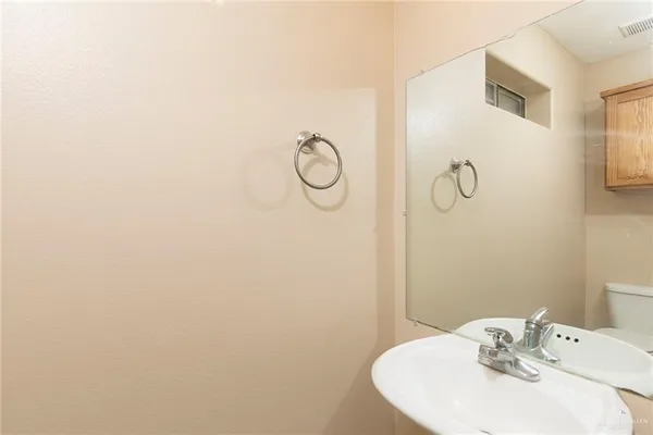a bathroom with a sink and mirror