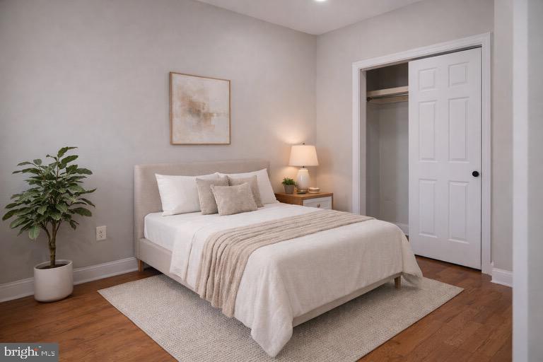 5538 Master Street Philadelphia, PA 19131 - Photo 13 of 30 a bedroom with bed and a potted plant