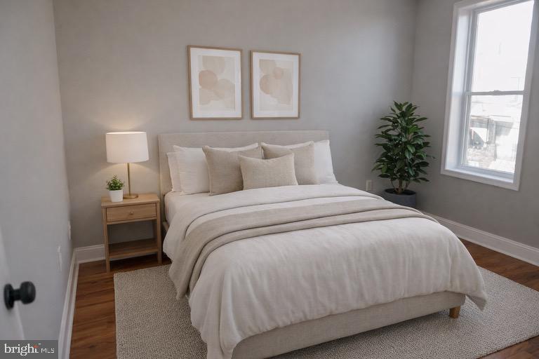 5538 Master Street Philadelphia, PA 19131 - Photo 17 of 30 a large bed sitting in a bedroom next to a window