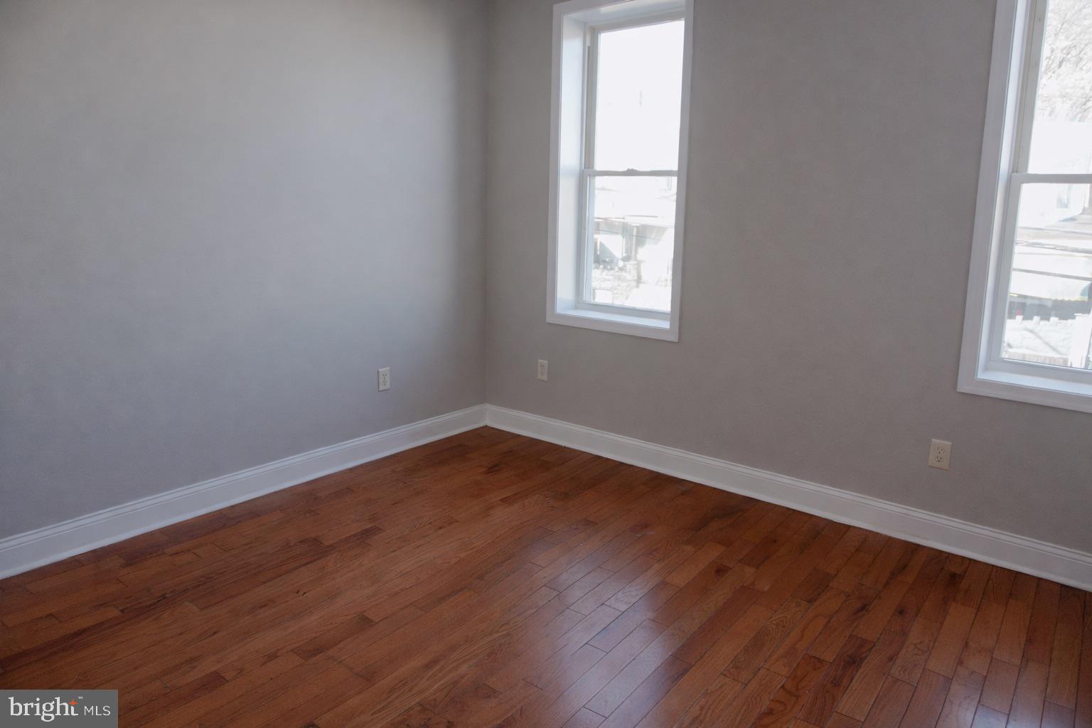 5538 Master Street Philadelphia, PA 19131 - Photo 18 of 30 an empty room with wooden floor and windows