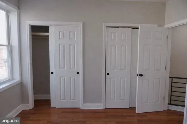 a view of a elevator with wooden floor