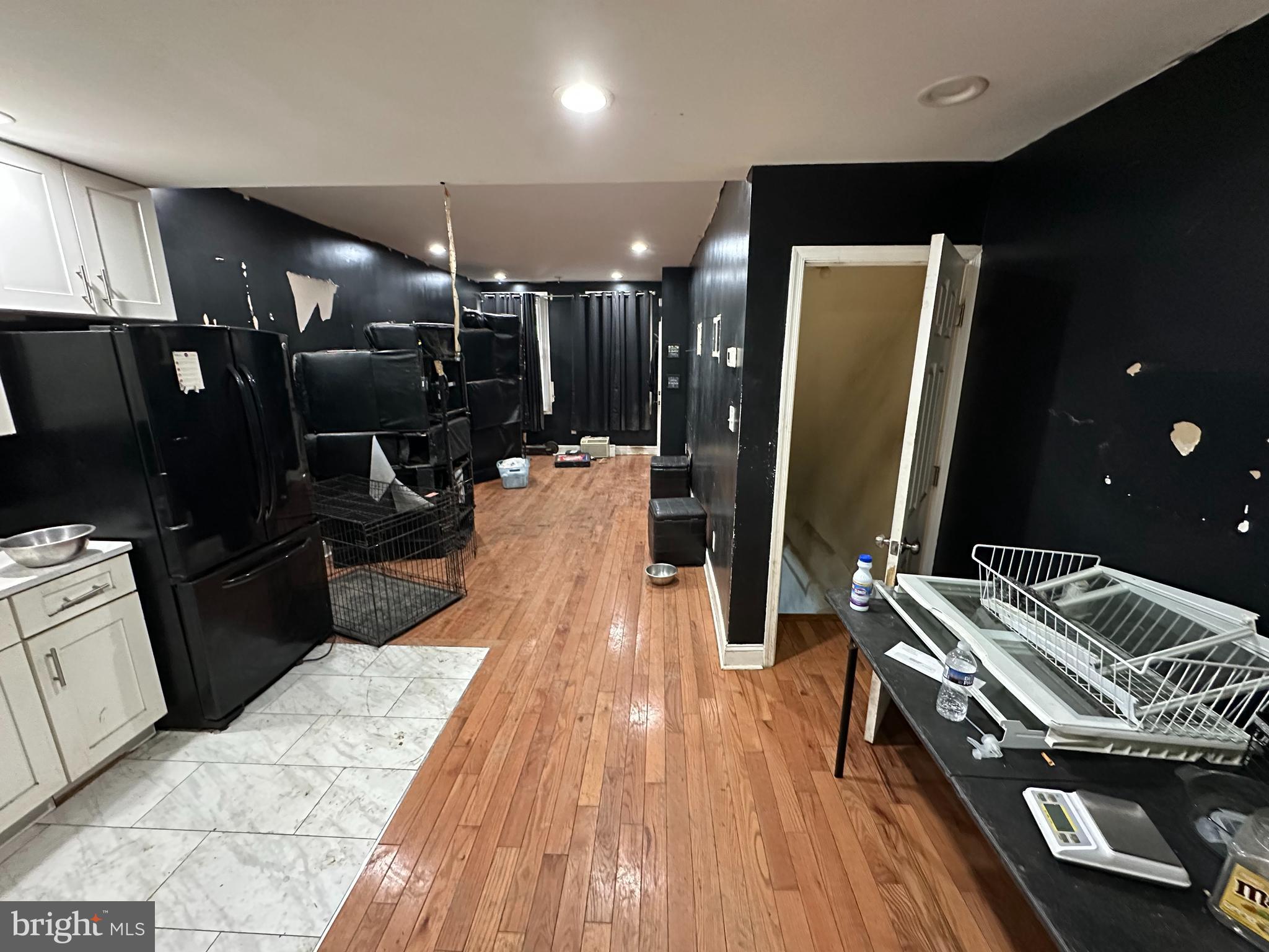 5538 Master Street Philadelphia, PA 19131 - Photo 23 of 30 a kitchen with stainless steel appliances kitchen island granite countertop a refrigerator and a stove