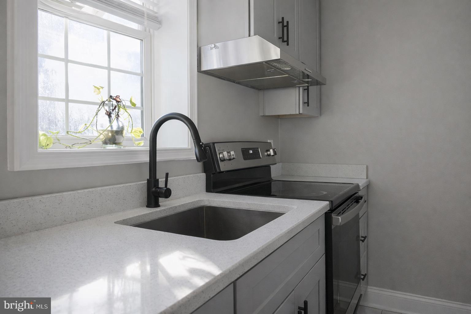 5538 Master Street Philadelphia, PA 19131 - Photo 6 of 30 a view of a kitchen with a sink and cabinets