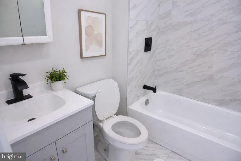 5538 Master Street Philadelphia, PA 19131 - Photo 10 of 30 a bathroom with a sink a toilet and bathtub
